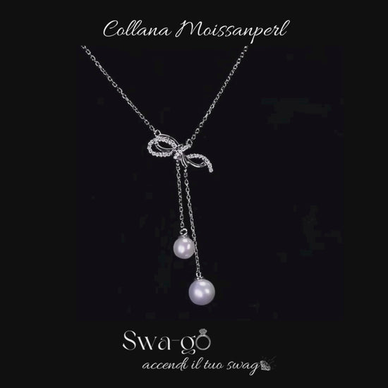 Video Gioiello elegante donna con design a fiocco e pietre
3	